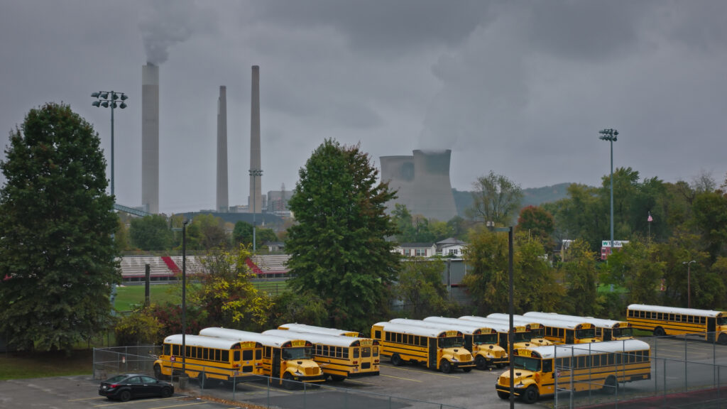 School Buses Parked in Shadow of Coal Fired Power Station in Putnam County, WV